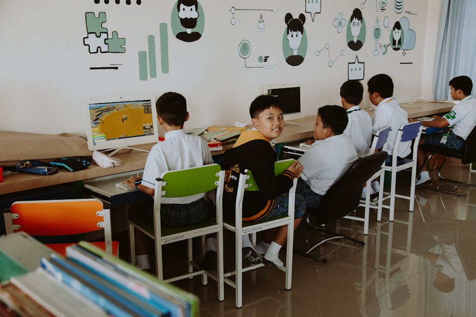 Elementary school students learning in a tech-driven, modern classroom setting