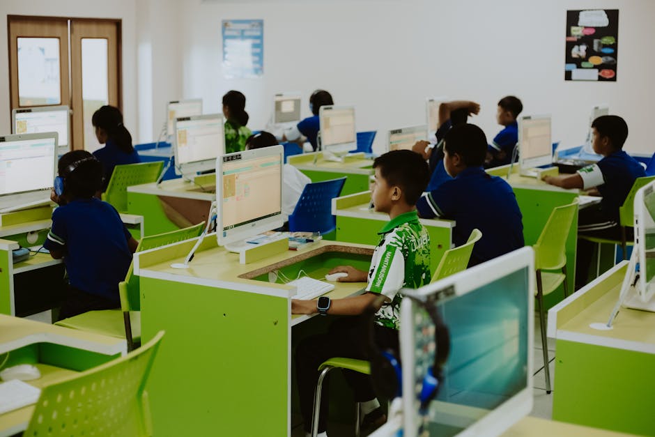 Children engaged in educational activities in a modern computer lab setting